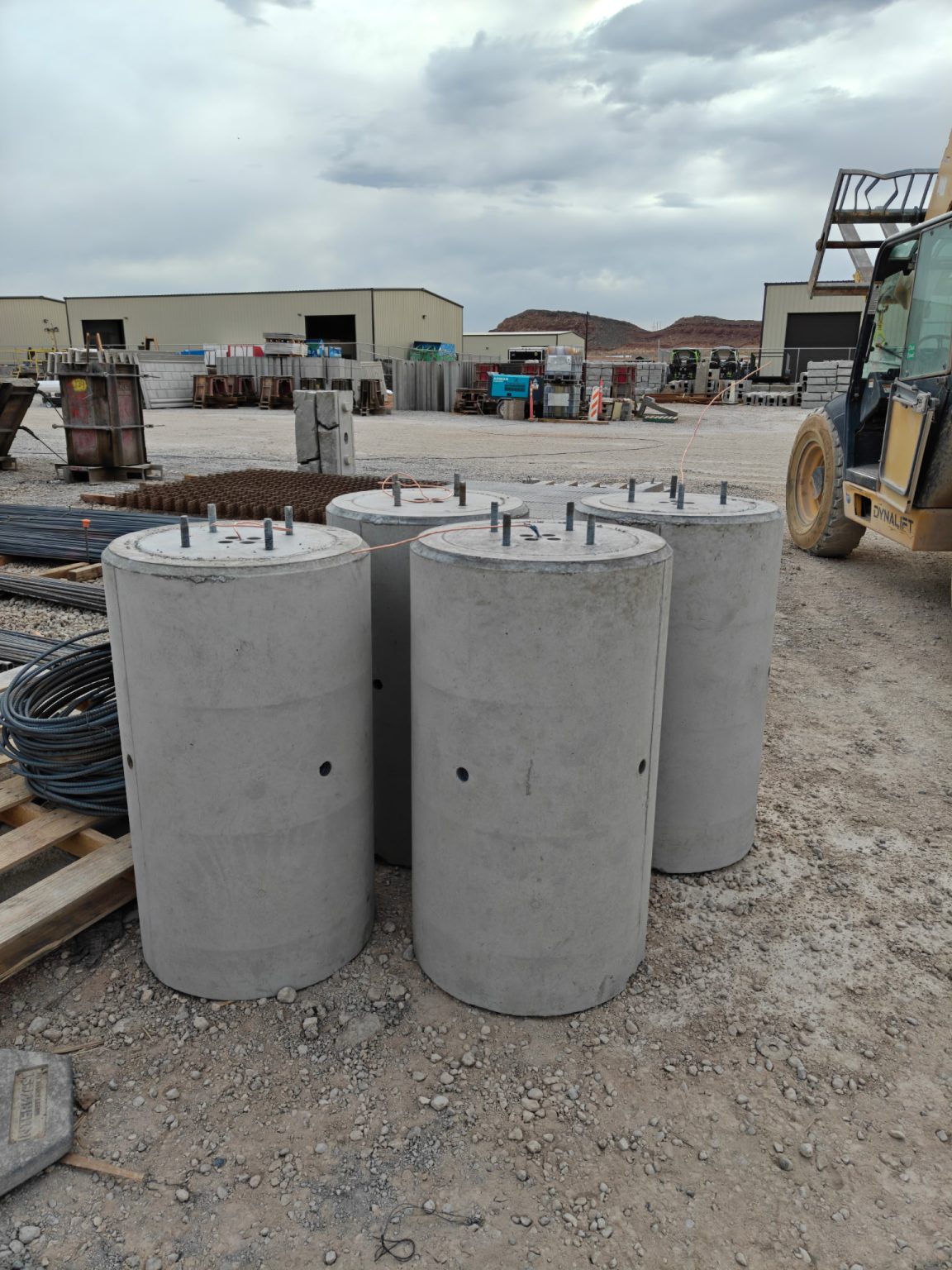 Group of precast light pole bases in the yard