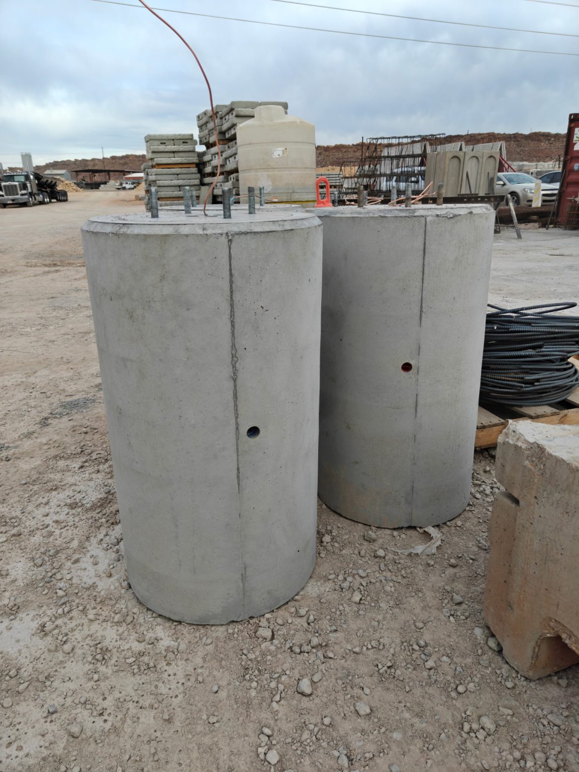 Precast light pole bases with side conduit openings